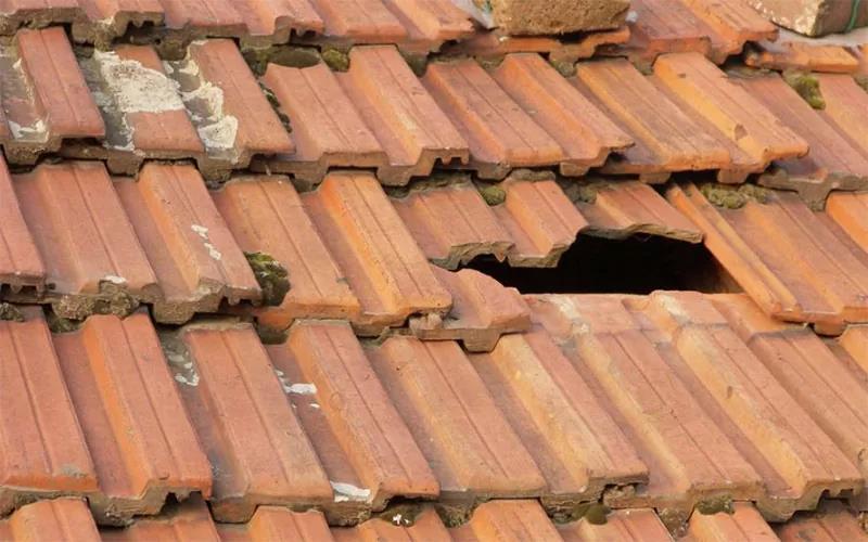 Cracked Cement and Loose Tiles